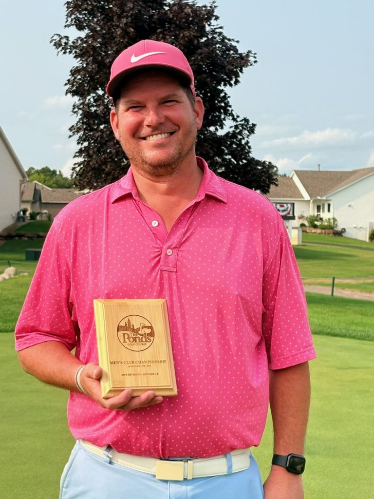 Golfer holding award
