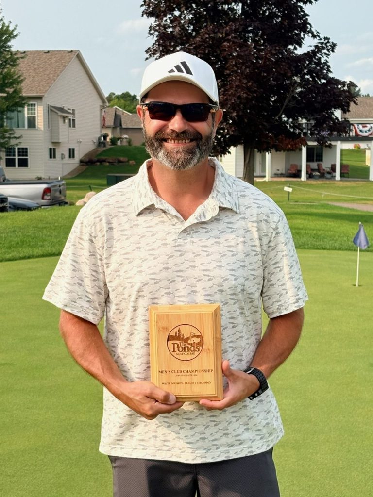 Golfer holding award