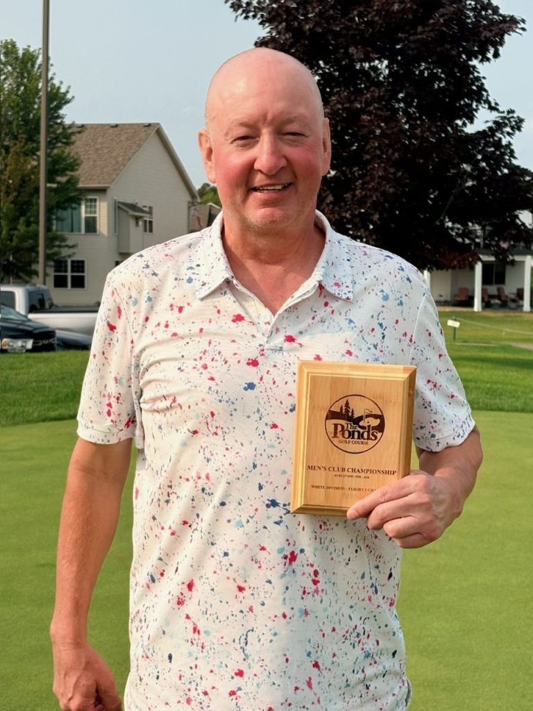 Golfer holding award