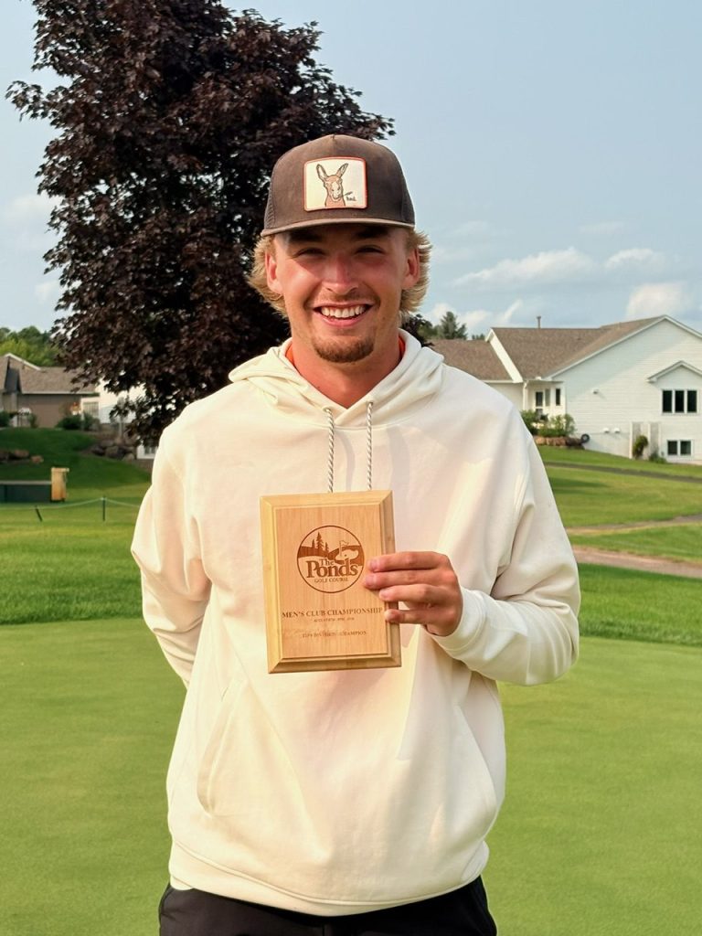 Golfer holding award